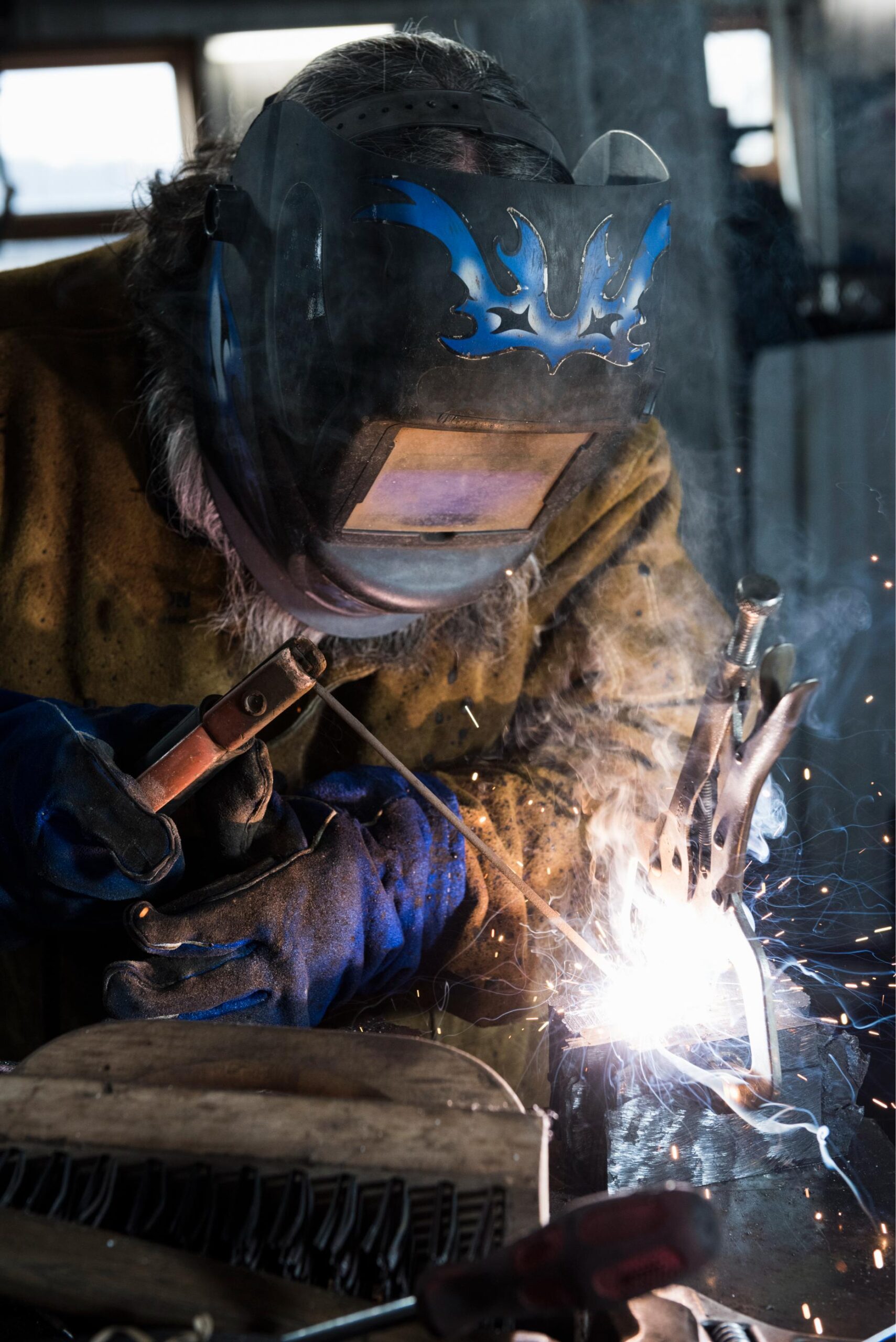 blacksmith-in-welding-mask-welding-metal-in-worksh-2025-04-03-06-15-36-utc (1) blacksmith-in-welding-mask-welding-metal-in-worksh-2025-04-03-06-15-36-utc (1)