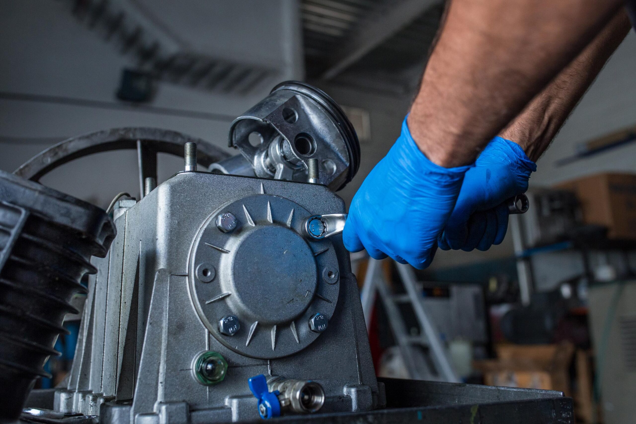 mechanic-fixing-a-compressor-engine-2025-04-03-06-14-48-utc (1)