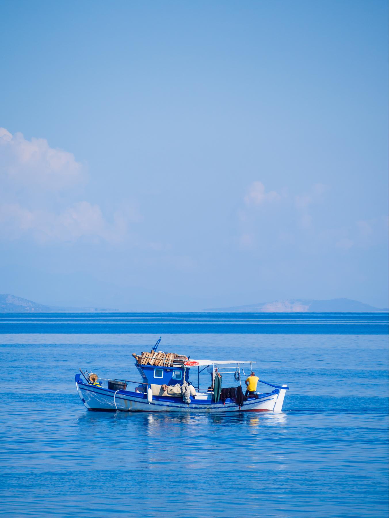 santorini-island-greece-white-boat-2025-02-10-07-42-44-utc (1)