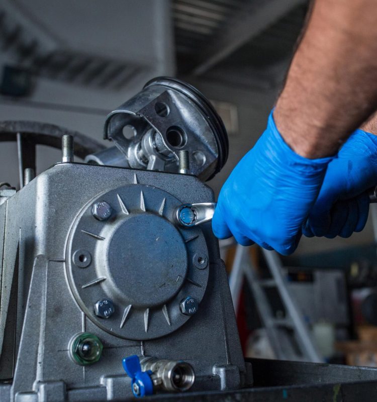 mechanic-fixing-a-compressor-engine-2025-04-03-06-14-48-utc (1)