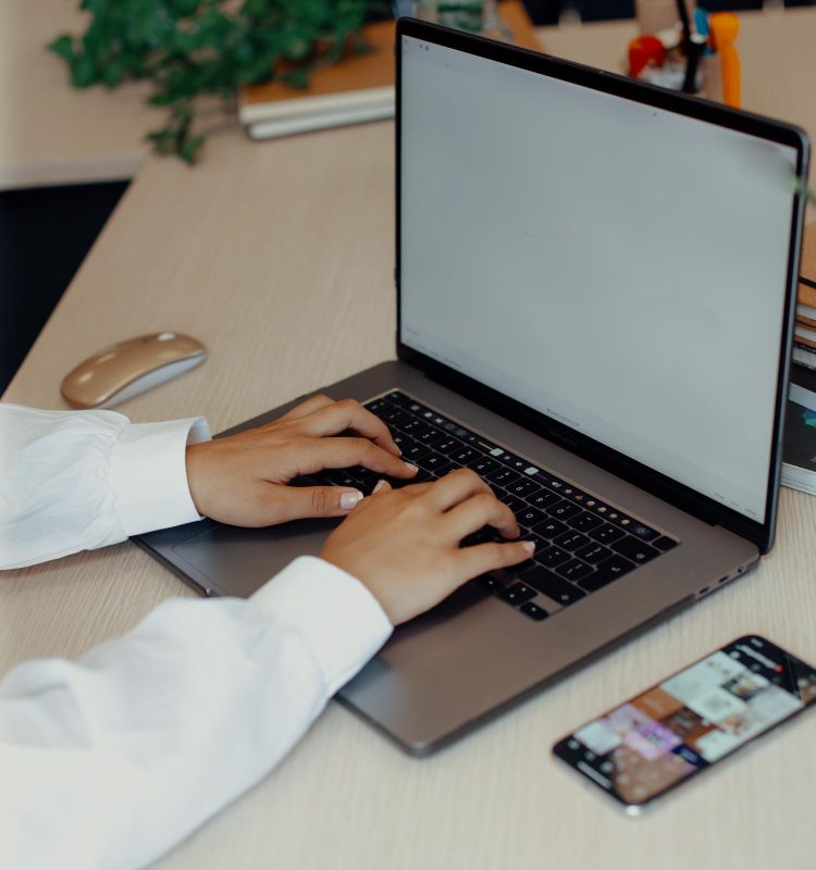 young-woman-typing-on-keyboard-at-desk-2024-12-03-14-50-53-utc (1)
